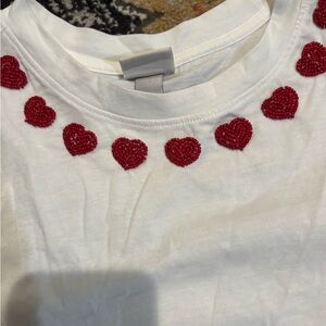 A new day White Tee with Red Heart Neckline Embellishment